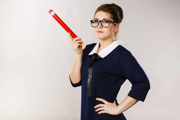 Woman confused thinking, big pencil in hand — Stock Photo, Image