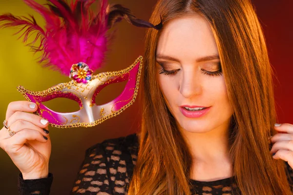 Woman holds carnival mask closeup — Stock Photo, Image