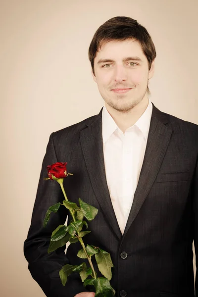 英俊的男人与玫瑰 — 图库照片