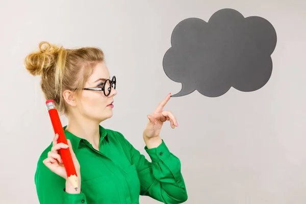 stock image Woman holding big oversized pencil thinking