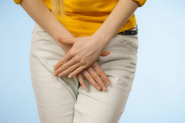 Woman with hands holding her crotch — Stock Image Woman with hands holding her crotch Royalty Free Stock Photos