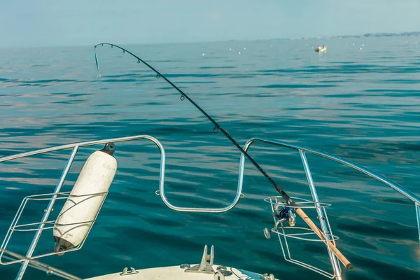 Sea view from yacht, fishing rod — Stock Photo, Image