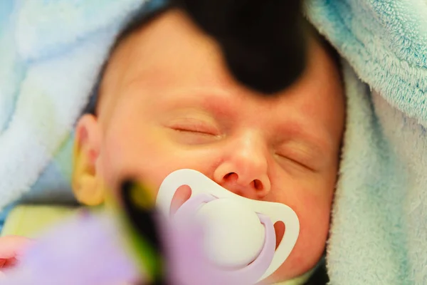 Little newborn baby sleeping with dummy — Stock Photo, Image