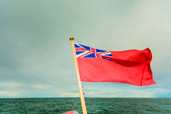 Uk red ensign the british maritime flag flown from yacht — Stock Photo, Image