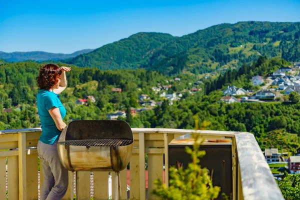 Woman on veranda enjoy norwegian landscape — Stock Photo, Image