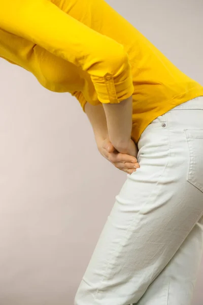 Woman with hands holding her crotch — Stock Image Woman with hands holding her crotch Stock Photo