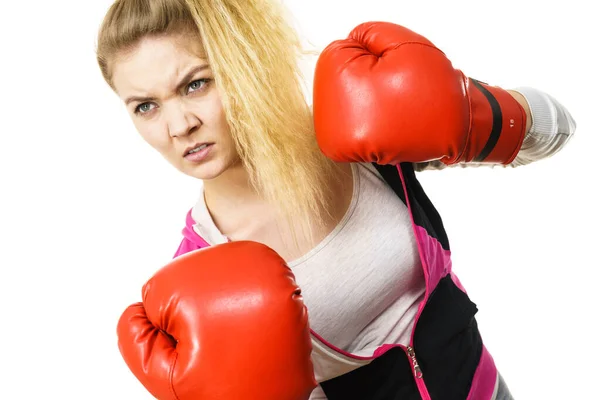 Angry woman wearing boxing gloves — Stock Photo, Image