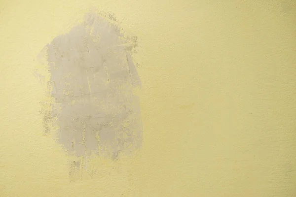 Plastered with gypsum hole in the yellow wall — Stock Photo, Image