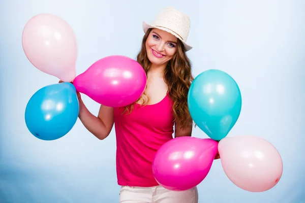 Woman playing with many colorful balloons — Stock Photo, Image