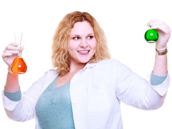 Chemist woman holds test flasks — Stock Photo, Image