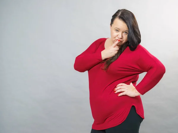 Big woman showing hand silence sign — Stock Photo, Image