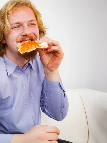 Man eating pizza, having fun. — Stock Photo, Image