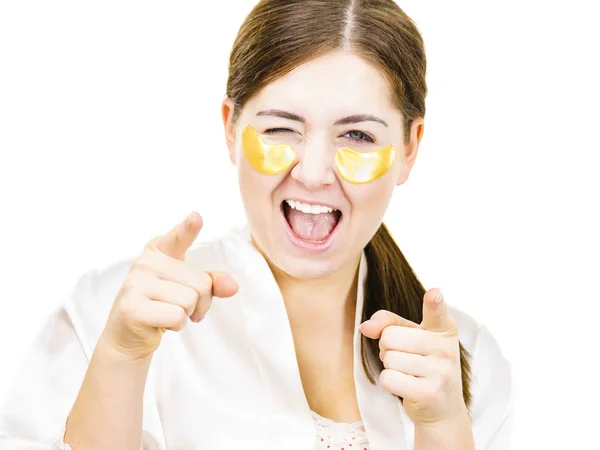 Woman with gold patches under eyes — Stock Photo, Image