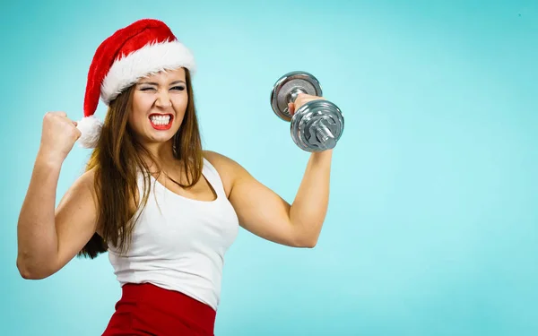 Santa claus woman lifting dumbbells — Stock Photo, Image