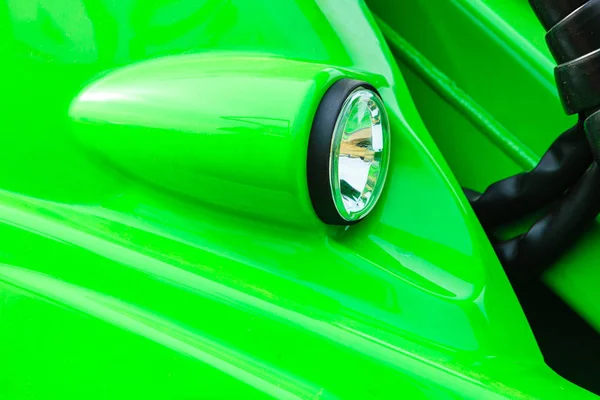 Reflector on big heavy green vehicle — Stock Photo, Image