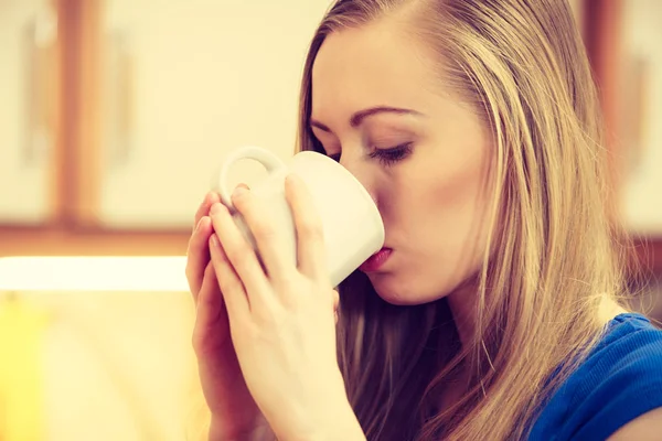 Woman holding cup of tea of coffee — Stock Photo, Image