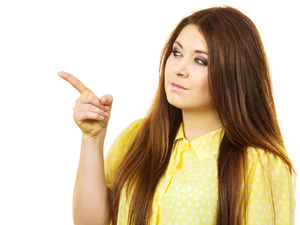 Woman pointing, serious face expression — Stock Photo, Image