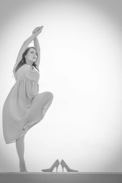 Woman dancing wearing long light pink dress — Stock Photo, Image