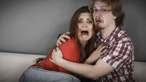 Funny couple watching horror movie — Stock Photo, Image