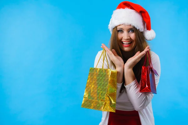 Happy Christmas woman holds gifts bag — Stock Photo, Image