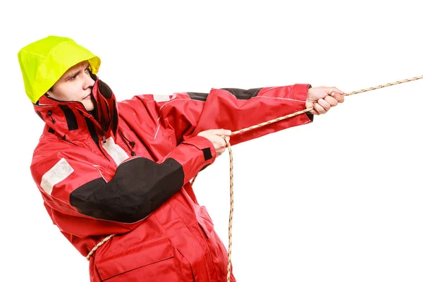 Young man pulling a rope — Stock Photo, Image