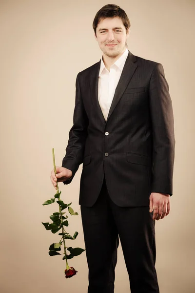 Handsome man with rose — Stock Photo, Image