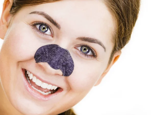 Woman applying pore strips on nose — Stock Photo, Image