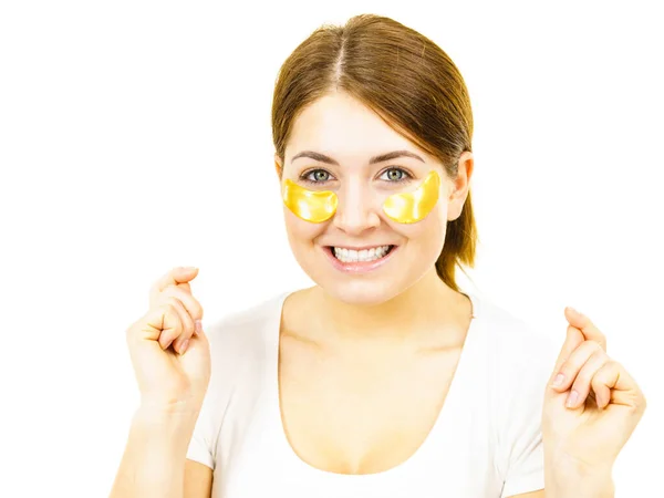 Young Woman Applying Golden Collagen Patches Eyes Mask Removing Wrinkles — Stock Photo, Image