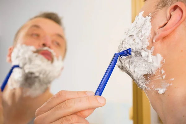 Man Lots Shaving Foam His Face Standing Bathroom Looking Mirror — Stock Photo, Image
