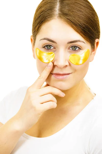 Young Woman Applying Golden Collagen Patches Eyes Mask Removing Wrinkles — Stock Photo, Image