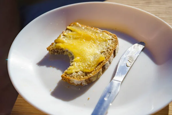 Preparing Breakfast Meal Rye Bread Slice Butter Honey White Plate — Stock Photo, Image