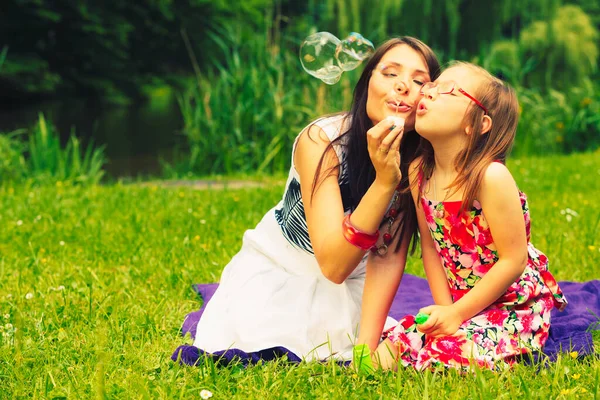 Mother Little Girl Daughter Child Blowing Soap Bubbles Outdoor Parent — Stock Photo, Image