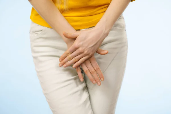 Closeup young sick woman with hands holding pressing her crotch lower abdomen. Medical or gynecological problems, healthcare concept — Stock Image Closeup Young Sick Woman Hands Holding Pressing Her Crotch Lower Stock Photo