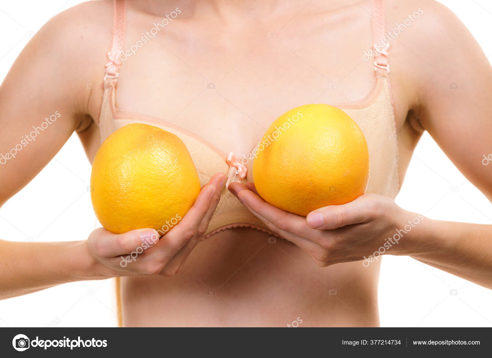 Slim Young Woman Small Boobs Wearing Bra Holding Big Orange Stock