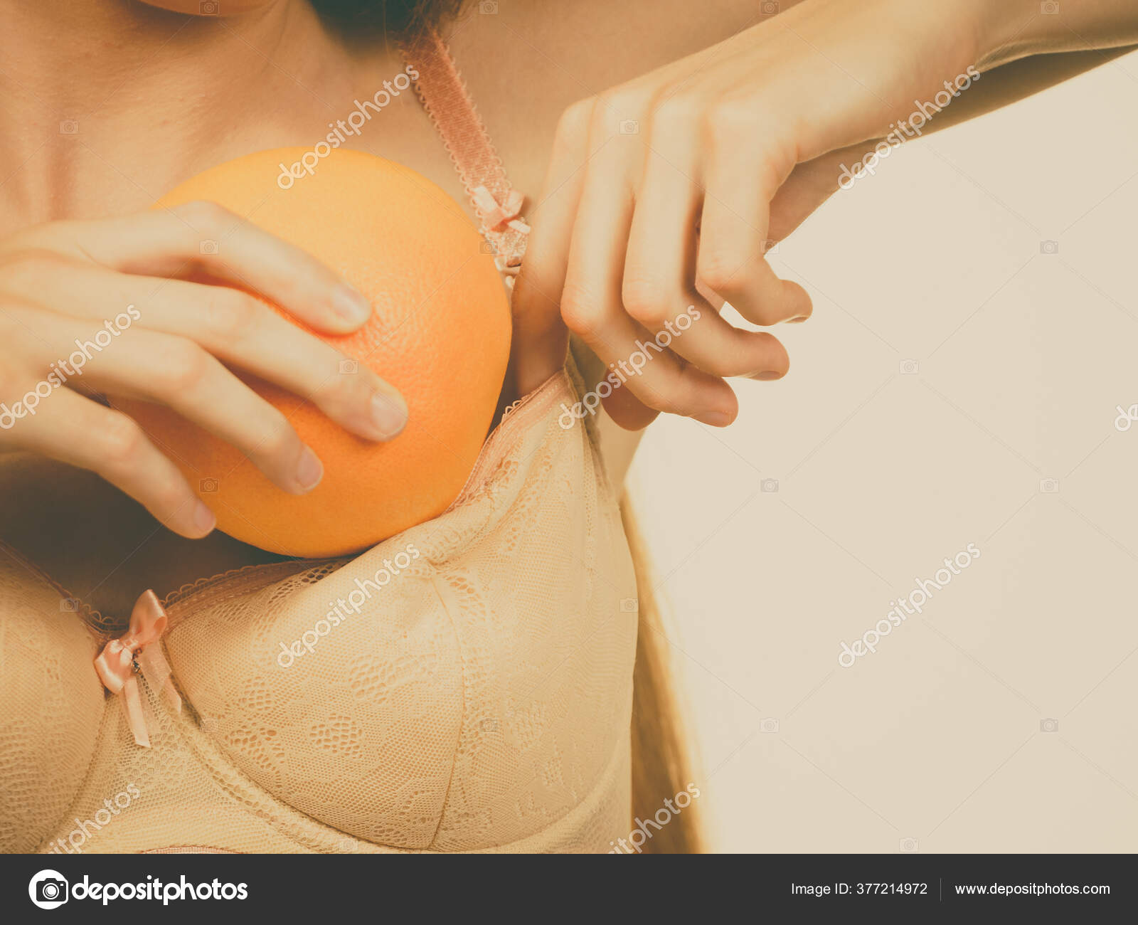 Young Woman Small Boobs Puts Big Fruit Grapefruit Her Bra Stock Photo by  ©Voyagerix 377214972