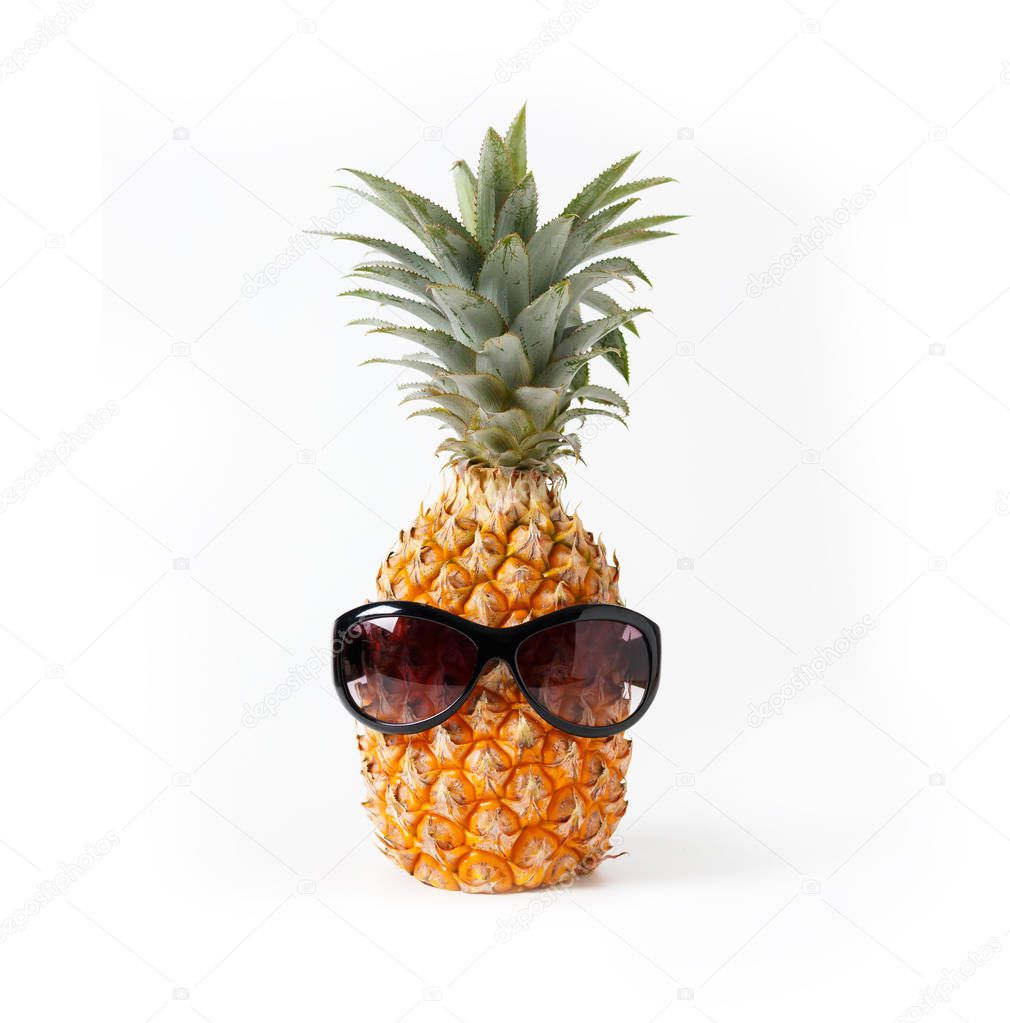 Pineapple wearing glasses in summer concept, white background