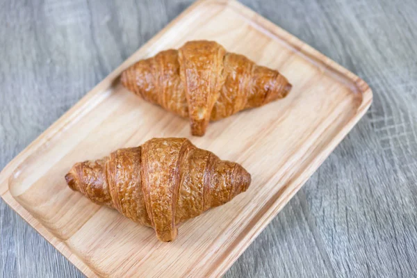 Two Croissant Placed Wooden Chopping Board Top View Select Focas — Stock Photo, Image