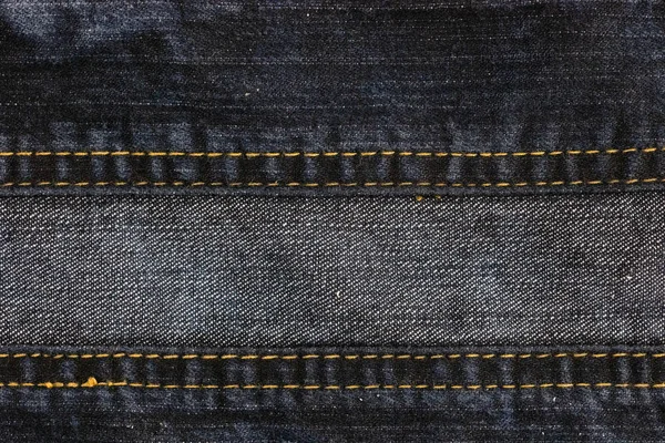 Eski denim kumaş dikişli. Arka plan ve doku Jean