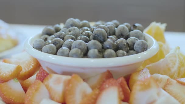 Grabbing Blueberries Fruit Bowl Close — Stock Video