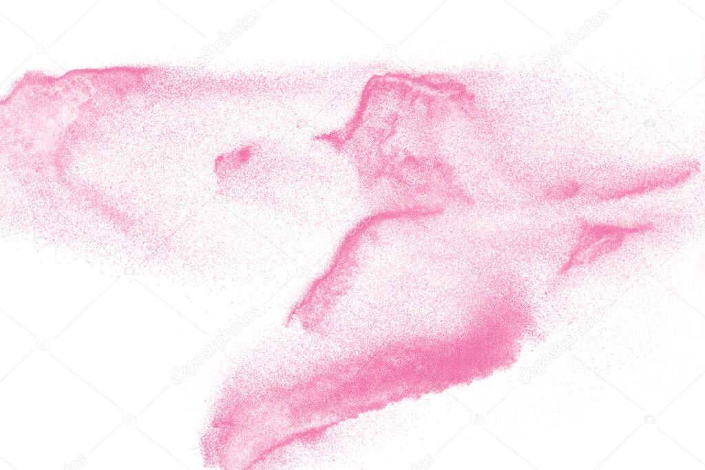 Pink colored sand splash against  white background.