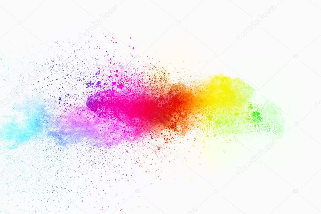 Colorful powder explosion on white background. Pastel color dust particle splashing.