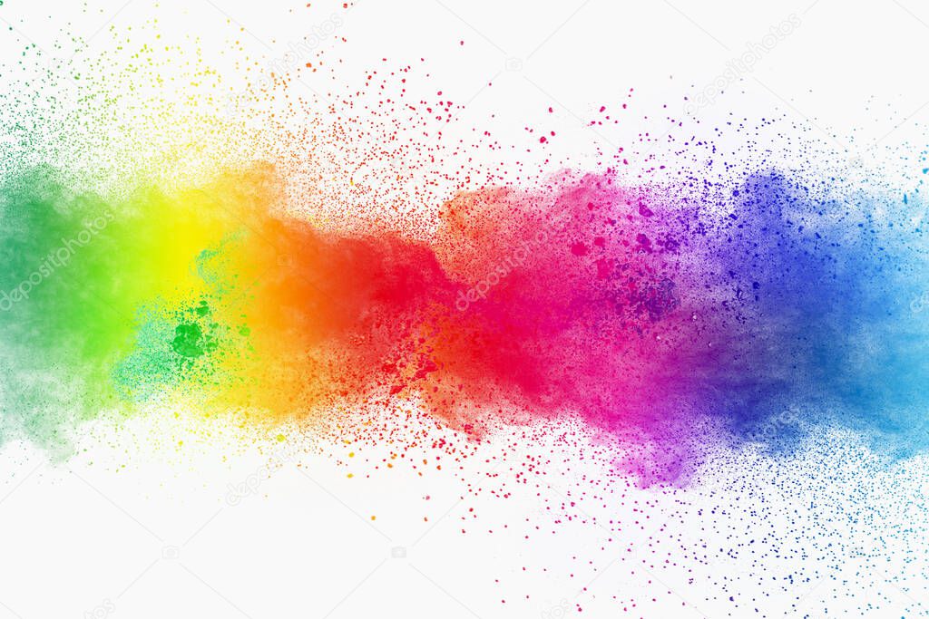 Colorful powder explosion on white background. Pastel color dust particle splashing.