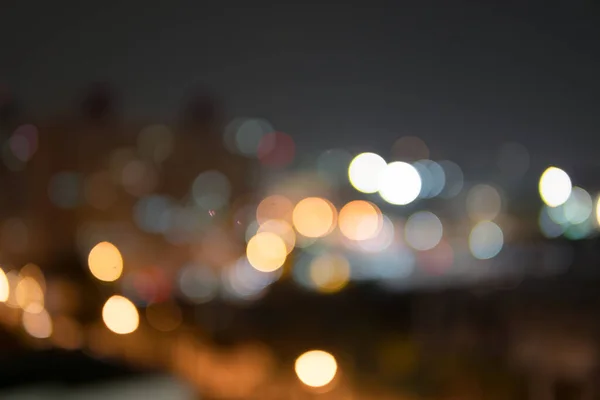 Abstract bokeh night garden in city background.Defocused city night filtered bokeh abstract background.