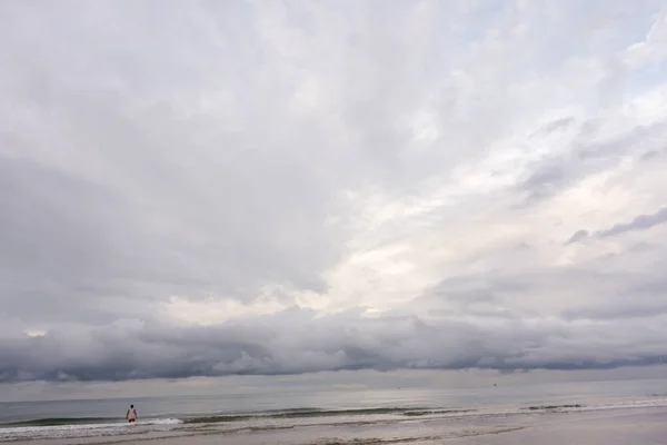 Storm clouds over the sea. Calm and moody seascape with a dramatic sky before storm.