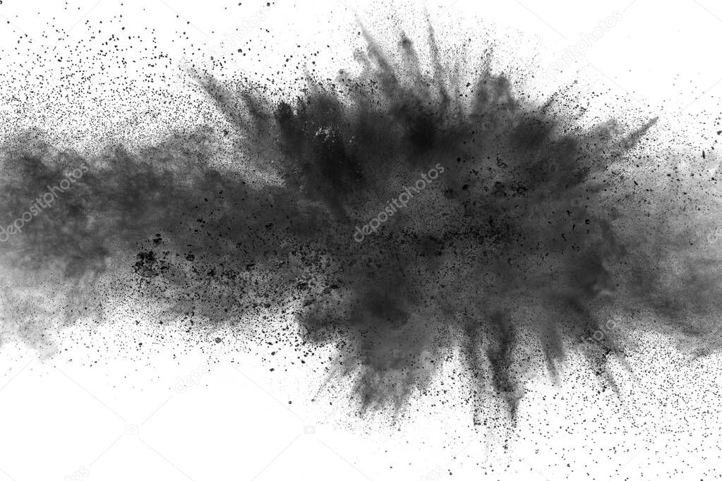 Black particles splatter on white background. Black powder dust burst.