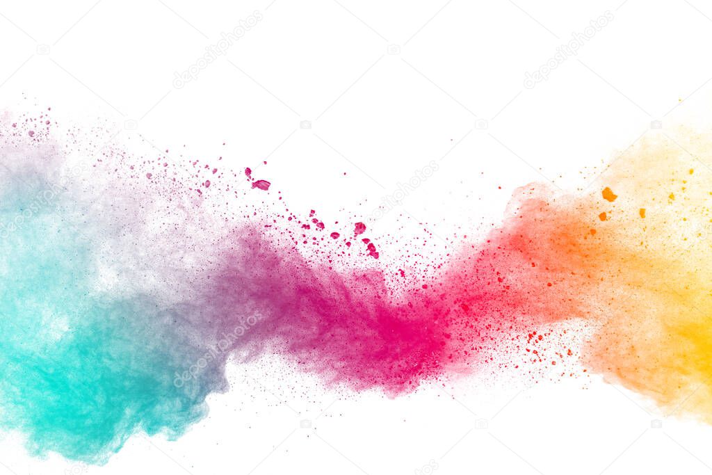 Abstract multicolored powder explosion on white background.Colorful dust explode. Painted Holi powder festival.