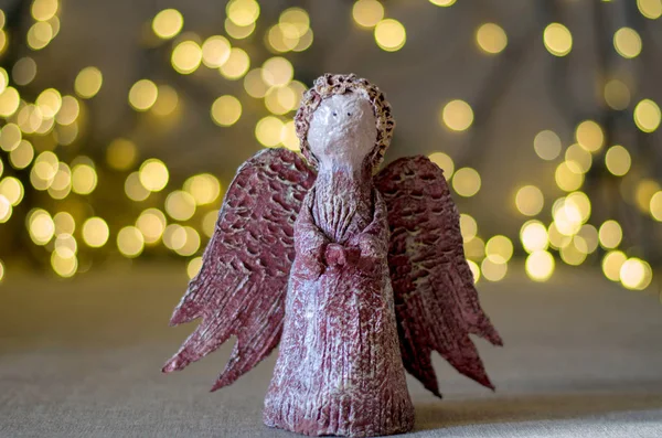 Christmas angel on the background of lights