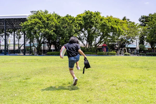 Back to school concept, Jumping cheerfully. — Stock Photo, Image