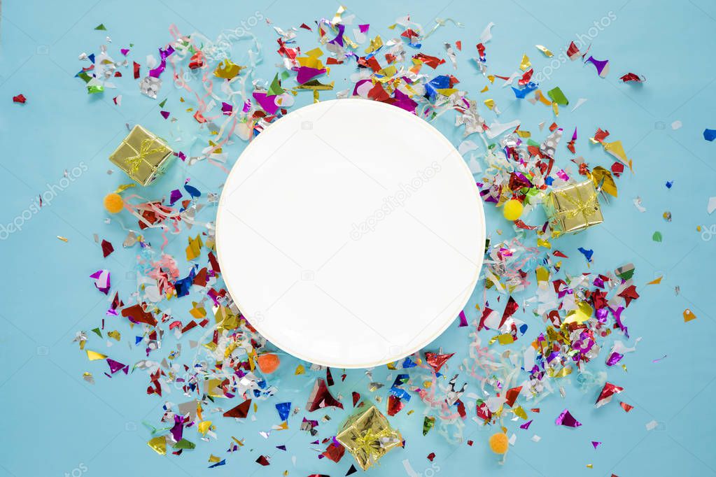 Celebrate success concept. A white circular dish placed in the m