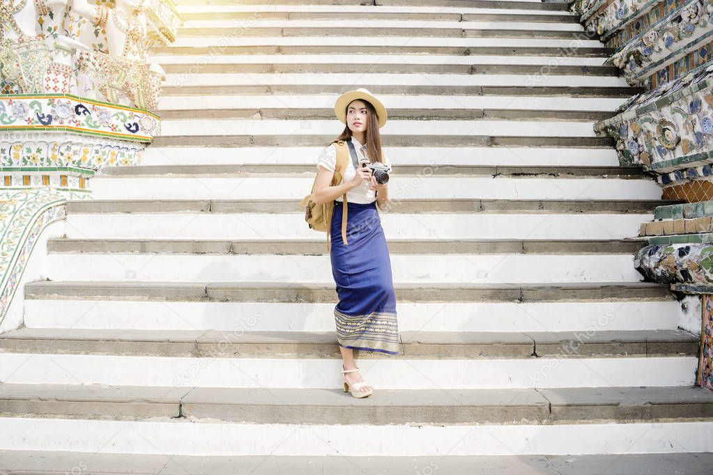 Asian woman tourist is traveling and sightseeing inside Wat Arun